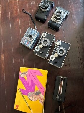 Kodak Retro Black and Silver Film Camera Collection with Yellow Box Accent